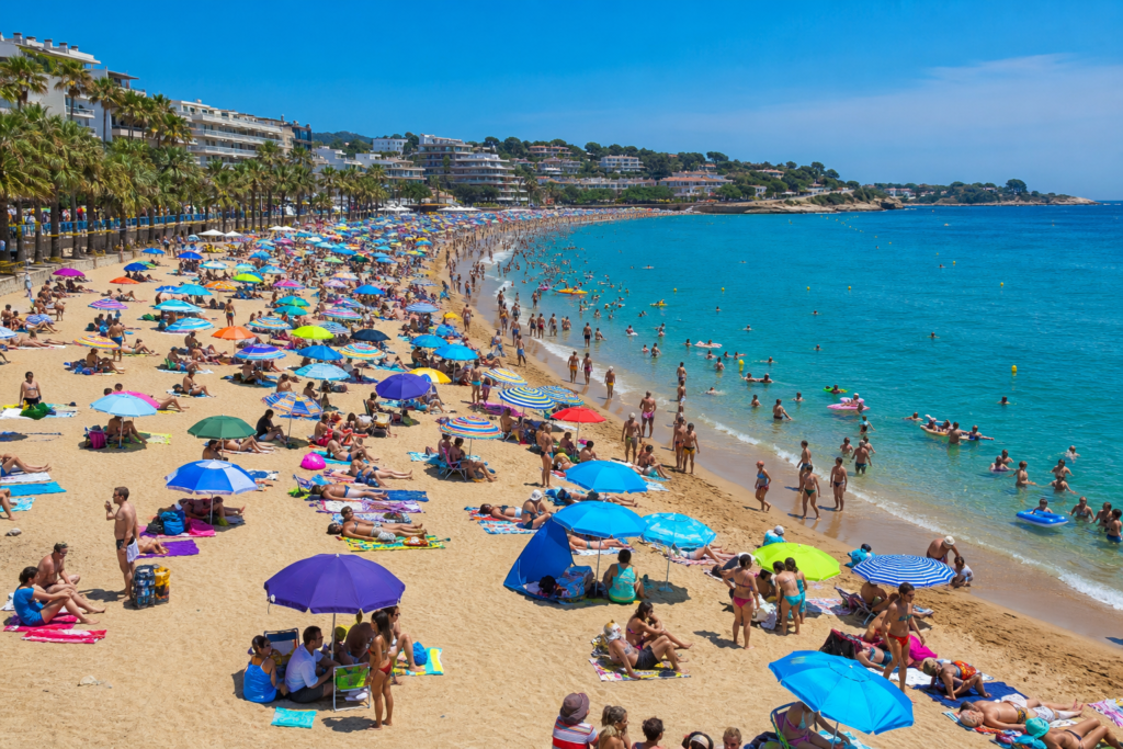 The Ultimate Guide to the Best Time to Visit Spain in 2026 13 August Spain busy beach